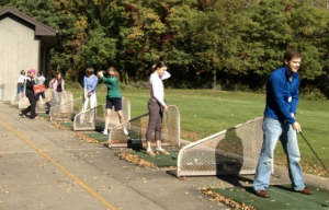 Young Professional Golfers Hitting the Driving Range in Cincinnati