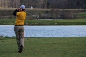 Golfer Teeing Off