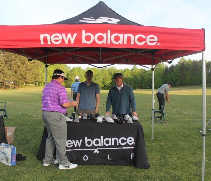 New Balance Golf tent with shoe display set up on course