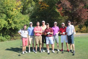 Young golfers on course dressed in bright clothes
